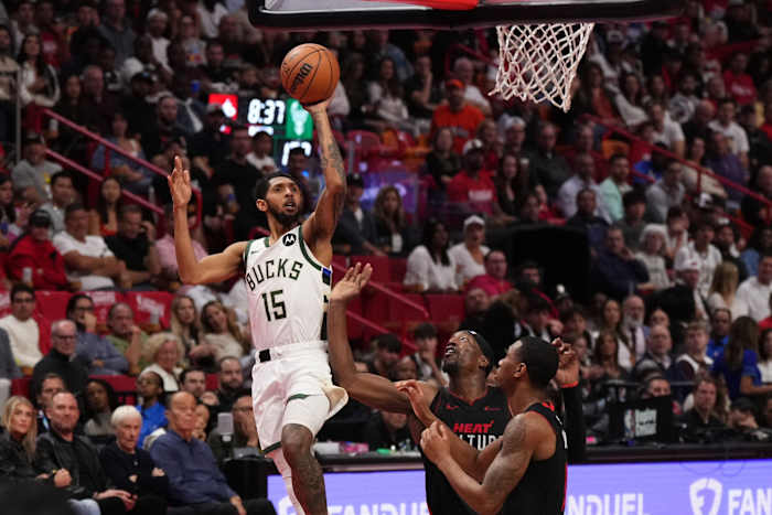Milwaukee Bucks guard Cameron Payne (15) shoots the ball over Miami Heat center Bam Adebayo (13)